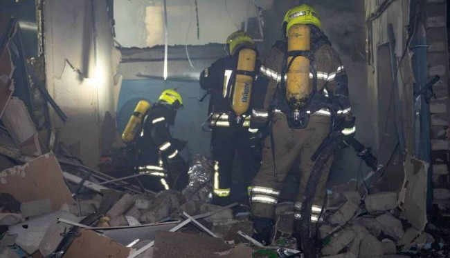 Russian drone strike damages business center in Odesa, one injured