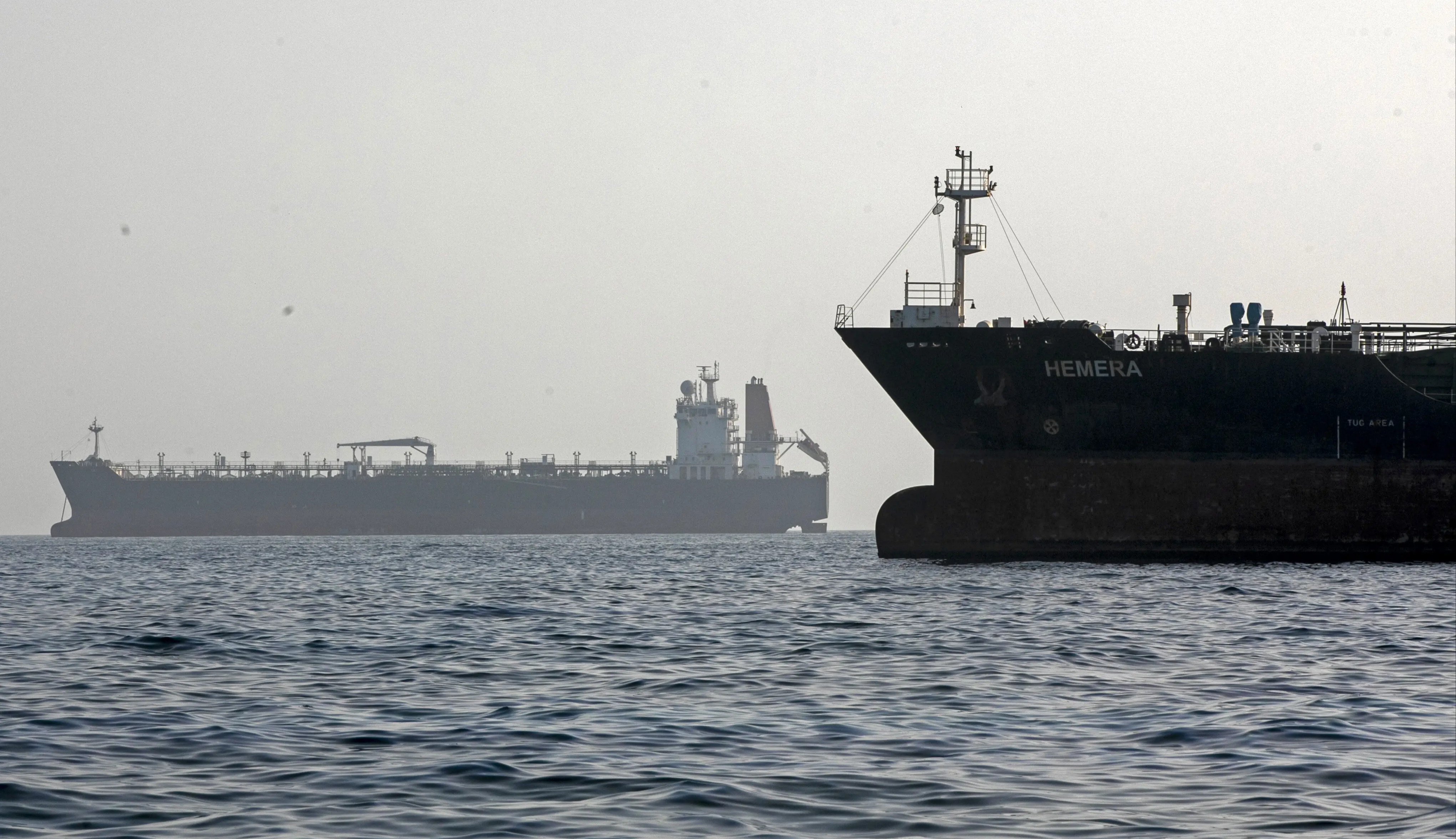 Iran announces closure of Strait of Hormuz after warning shot at vessel